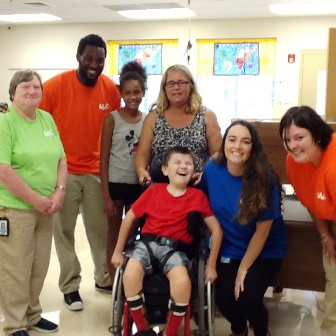 Washington Center teacher, Ryana Smith-Wilson, with Para-educators Dianne Miller, Antrez McDaniel and Abigail Durbin, welcome student Austin Mark and his family during the beginning of the year Meet the Teacher event.